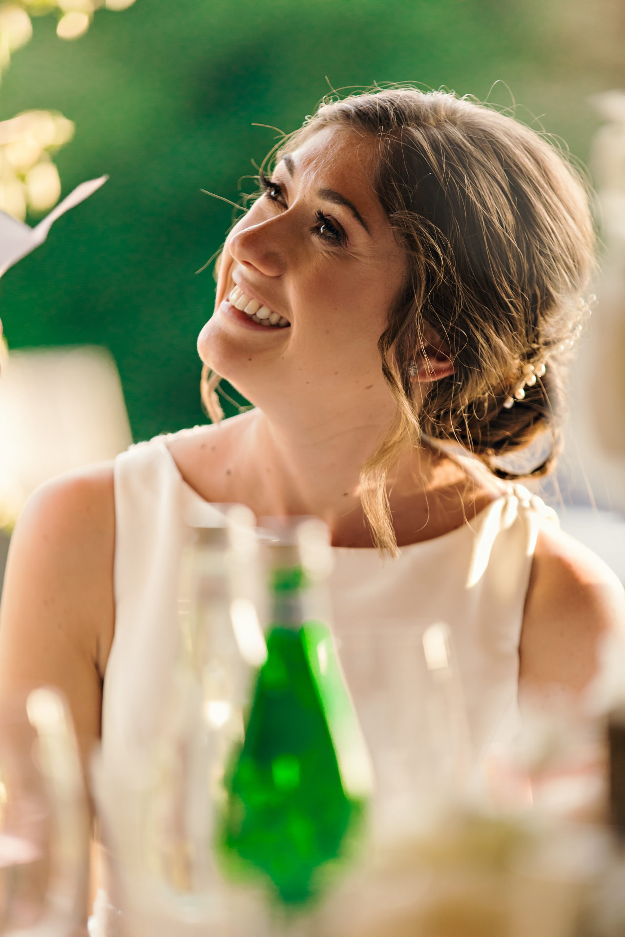 A bride laughing during the wedding reception
