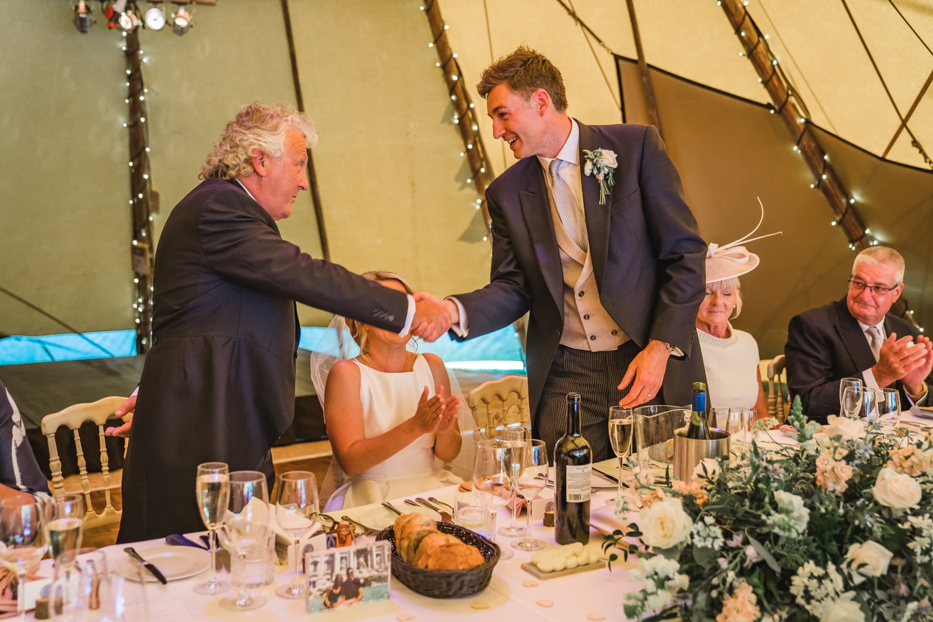 Father of the bride and groom shaking hands during speeches at Sumner's Ponds